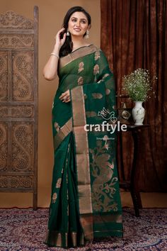 Upgrade your wardrobe with our Handloom Sacramento Green Zari Saree. This saree celebrates the rich textile heritage of Bengal with its intricate weaving and fusion of traditional and modern designs. Crafted from soft, breathable fabric, it offers both style and comfort for all-day wear. Embrace the timeless elegance of ethnic fashion and expert craftsmanship with our stunning and sustainable Handloom Sacramento Green Zari Saree. Make a statement at any occasion with this exceptional piece.Saree Elegant Unstitched Saree With Woven Motifs, Elegant Art Silk Saree With Woven Motifs, Elegant Festive Saree With Woven Motifs, Elegant Blouse Piece With Woven Motifs For Festive Occasions, Elegant Festive Blouse Piece With Woven Motifs, Cotton Silk Saree With Woven Motifs, Elegant Saree With Woven Motifs, Chanderi Saree With Woven Motifs For Navratri, Designer Traditional Wear With Woven Motifs