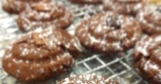 chocolate cookies are cooling on a wire rack