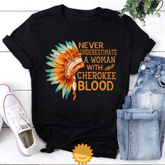 Product details: ✔️ NAME: Never Underestimate A Woman With Cherokee Blood Vintage T-Shirt, Native American Shirt, Native Land Shirt, Indigenous Shirt ✔️ IMPORTANT NOTE: Both Men and Women can we our shirts because this is unisex style t-shirts;  Wash item inside out in cold water, do not bleach, do not dry clean, do not iron directly on the design. ✔️ MATERIAL: 5.3-ounce, 100% cotton (99/1 cotton/poly (Ash) & 90/10 cotton/poly (Sport Grey); Heavyweight classic unisex tee; Taped neck and shoulders; Tearaway label; Decoration type: Digital Print ✔️ OUR DESIGN PRODUCTS: Each One are designed and sold in limited quantities. The designs are created by our incredibly talented in house graphic art team who often hand draw and illustrate each Tee shirt design. ✔️ SIZE CHART: Please refer the attac Native American Inspired Fashion, Native American Shirt, Native American Shirts, Never Underestimate A Woman, Style T Shirts, Tee Shirt Designs, Never Underestimate, American Shirts, Unisex Style