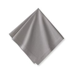 two silver napkins sitting on top of each other