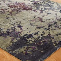 an area rug with many different colors and shapes