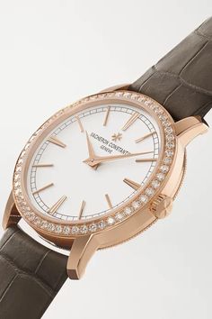 Vacheron Constantin's 'Traditionnelle' timepiece celebrates the house's long history of fine Swiss watchmaking. Simple and refined, this 18-karat pink gold model features a classic round case embellished with 0.87-carats of sparkling diamonds. It's powered by the maison's calibre 1400 - visible through the exhibition back - that's certified with the Hallmark of Geneva for its exceptional decorative finishing and chronometric precision. The 'Warm Gray' alligator strap is so elegant. We offer a Vacheron Constantin, Gold Models, Gold Hands, The Exhibition, Warm Grey, Gold Case, Cluse Watch, Diamond Watch, Sparkle Diamonds