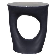 a black stool with an oval shaped design on the top and bottom, against a white background