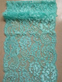 a piece of blue lace sitting on top of a table