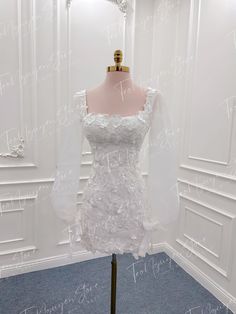 a white dress on display in a room