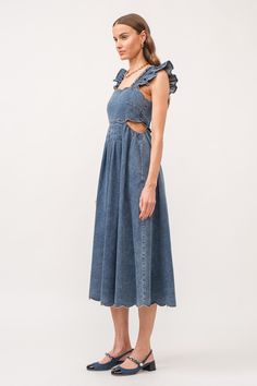 Denim is a timeless essential in your closet and the new Asher Denim Midi Dress is a must! This dark wash dress boasts a stylish cut out design and feminine ruffle detailing on the shoulder straps. Perfect for dressing up for any occasion or dressing down. This mid length dress will elevate your style and turn heads wherever you go. Model is 5'9 wearing a size small. Spring Sleeveless Denim Dress With Ruffles, Sleeveless Denim Ruffle Dress, Sleeveless Denim Ruffled Dress, Sleeveless Denim Dress With Ruffles, Medium Wash Midi Dress For Brunch, Brunch Midi Dress In Medium Wash Denim, Brunch Midi-length Dress In Medium Wash, Denim Blue Midi Dress For Brunch, Medium Wash Denim Dress With Ruffles