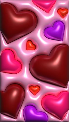 many hearts are arranged on a pink and purple background with red, orange, and blue colors