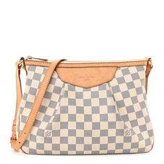 This is an authentic LOUIS VUITTON Damier Azur Siracusa PM. This stylish shoulder bag is crafted of Louis Vuitton damier azur blue and white checkered canvas with a distinctive pleated structure design. It features an adjustable signature vachetta cowhide leather shoulder strap and polished brass hardware and buckle. The polished brass top zipper opens to a beige fabric interior with pockets. Louis Vuitton Crossbody Bag, Louis Vuitton Crossbody, Louis Vuitton Empreinte, Embroidered Monogram, Louis Vuitton Damier Azur, Stylish Shoulder Bag, Lv Monogram, Beige Fabric, Structure Design