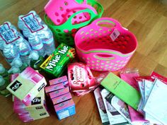 various items that are on the floor next to some water bottles and candy bar wrappers