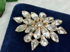 "A vintage rhinestone dress clip. These are lovely worn on a v-neck, converted to pendants, or worn on a wedding sash. Measures about 2.53\" long and 1.77 wide. No marks. Good vintage condition. Was originally intended as a shoe clip, I believe, but will work as a dress clip. Actual packaging will vary depending on item/s purchased and tape pattern available. Props shown in photos is for display purposes only, not included in this listing. As always, satisfaction is guaranteed. Thanks for shoppi Wedding Costume Jewelry Brooches With Sparkling Stones, Vintage Sparkling Wedding Brooches, Wedding Crystal Brooches With Sparkling Stones, Glamorous Rhinestone Wedding Brooches, Rhinestone Costume, Rhinestone Costumes, Dress Clips, Wedding Jewelry For Bride, Tape Pattern