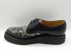 This timeless "Diano" creeper showcases sleek black leather and distinctive detailing, including a Goodyear welted crepe sole. Originally crafted in the late 1950s and revived for punk enthusiasts, this shoe boasts a 24mm front sole and a 36mm back sole. Created by the renowned George Cox, designer of the original Creeper shoe. Retro Black Oxfords For Derby, Retro Black Oxfords With Leather Sole, Vintage Black Leather Shoes With Stitched Sole, Fred Perry Amy Winehouse, Creepers Shoes, Fur Accessories, Tripp Nyc, Music Note, Goodyear Welt