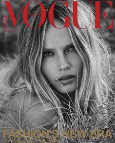 a magazine cover with a beautiful blonde woman in the grass on it's front page