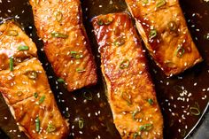 salmon fillets with sesame seeds in a skillet