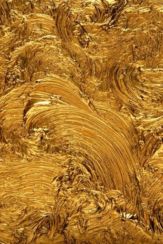 an abstract gold background with wavy lines