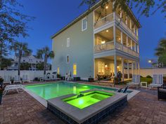 a house with a swimming pool in front of it