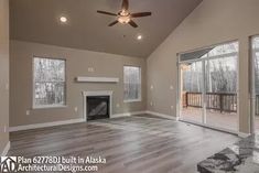 an empty living room with sliding glass doors and a fireplace in the center, surrounded by wood flooring