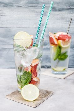 two glasses filled with different types of drinks