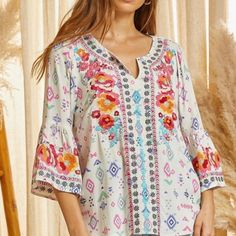 Beautiful Embroidered Top With 3/4 Sleeves. Spring Floral Embroidered Top With 3/4 Sleeve, Floral Embroidered Top With 3/4 Sleeves For Spring, Multicolor Embroidered Tops With 3/4 Sleeve, Spring Multicolor Blouse With Embroidered Hem, Spring Multicolor Embroidered Hem Blouse, Multicolor Geometric Embroidered Top For Spring, Casual Floral Embroidered Top For Brunch, Spring Embroidered Top With Geometric Multicolor Embroidery, Embroidered Tops With 3/4 Sleeve For Vacation