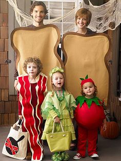 three children dressed in costumes standing next to each other