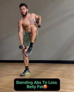 a man with no shirt is holding two dumbbells and standing on one leg