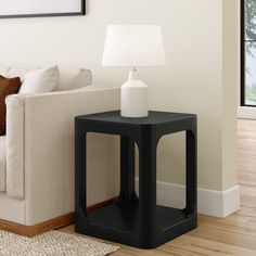 Elevate your living space with the Plank+Beam Forma Square Side Table, a harmonious blend of durability, style, and functionality. Crafted with precision, this table features a solid pine wood tabletop, legs, and a convenient bottom shelf, providing a modern aesthetic and sturdy construction. Our commitment to safety is evident in the non-toxic finishes applied to every inch of this end table. Enjoy peace of mind knowing that every detail is designed with your well-being in mind, making it a per Corner Table Living Room, Side Table With Shelf, Black End Tables, Cube Side Table, Table Decor Living Room, Black Living Room, Living Room Essentials, Table For Small Space, Square Side Table