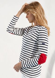 Shop our timeless Sailor shirt with a twist! The classic striped shirt in heavyweight cotton is adorned with red heart-shaped elbow patches and contrasting red fabric inside the neckline and cuffs. Perfect for a casual Valentine's day gift but also any time of the year you want to celebrate someone special! Also available in kids' sizes for the cutest mommy-and-me look! Made in Saint-James, Normandy, France. Cheetah Print Sweatshirt, Sailor Shirt, Black And White Shorts, Normandy France, Blue And White Style, Collared Sweatshirt, Emily In Paris, Sweatshirt Short Sleeve, Saint James