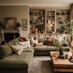 a living room filled with furniture and a fire place in the middle of the room