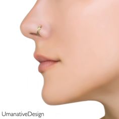 a woman's nose with an ear piercing in gold plated sterling or silver