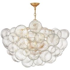 a chandelier with many glass balls hanging from it's golden metal frame