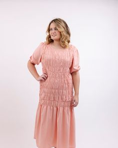 This Blush Dress is the perfect way to look your best! Crafted with soft cotton fabric, it fits perfectly at the waist and its beautiful blush hue adds a subtle elegance. Feel amazing and look stunning in this gorgeous dress! A must-have! Round out your vacation and weekend wardrobe with this plus size dress BeReal Blush Cotton Blend Pink Woven Midi Dress | Pink | Dresses | Materials & Care Instructions: ['80% Cotton, 20% Polyester', 'Machine wash', 'Imported'] Spring Peach Dress With Smocked Back, Blush Flowy Short Sleeve Dress, Peach Midi Length Dress For Brunch, Peach Midi Dress For Brunch, Modest Spring Dress With Ruched Detail, Modest Ruched Dress For Spring, Modest Ruched Midi Dress For Spring, Elegant Pink Maxi Dress With Smocked Back, Feminine Knee-length Dress With Gathered Waist