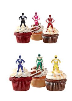 four cupcakes with different colored figures on top of each one in the shape of superheros