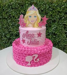 a barbie birthday cake on top of a table