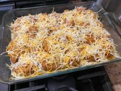 a casserole dish with cheese and meat in it on top of an oven