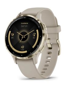 the garmin smart watch is shown in gold and grey with a black dial on its face