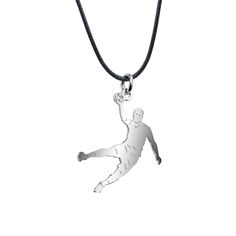 a silver pendant with a soccer player on it's back and a black cord