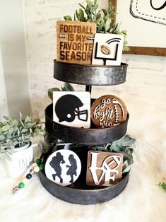 three tiered tray with football themed cookies on it