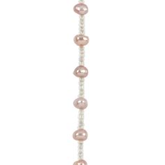 a long strand of pink pearls on a white background