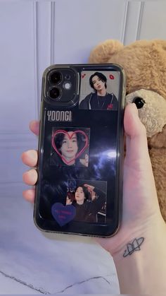 a person holding up a cell phone case with photos on it