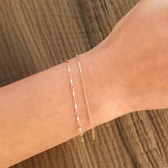 This is a set of layering bracelets inspired by our Shoreline and Shoreline Toggle Necklace. These bracelets look stunning when layered together but also when each bracelet is worn individually or with other bracelets to complete your fabulous look. Made out of high quality gold filled materials and perfect for everyday wear. One set of two chain bracelets: Spring ring clasp (6mm) 14K gold filled chain 1" extender option available Nickel-free Adjustable Chain Bracelets For Layering, Adjustable Stackable Chain Bracelet For Layering, Delicate Bracelets For Layering, Delicate Layering Bracelets, Dainty Delicate Chain Bracelets For Layering, Minimalist Double Strand Bracelet With Adjustable Chain, Layering Bracelets With Delicate Chain, Dainty Bracelets For Layering, Minimalist Adjustable Chain Bracelets For Layering