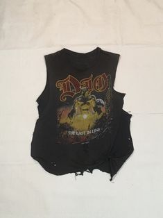 vintage 80s ronnie James dio 1984 the last in line tour cut off t shirt muscle tee by RabiaYMiel on Etsy Distressed Crew Neck Muscle Tee For Streetwear, Vintage Ripped Crew Neck Top, Distressed Band Merch Top In Faded Color, Faded Band Merch Top For Summer, Distressed Acid Wash Punk Tops, Acid Wash Graphic Print Muscle Tee With Crew Neck, Faded Band Merch Tops For Streetwear, Acid Wash Distressed Punk Tops, Vintage Cotton Muscle Tee For Streetwear