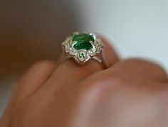 Gorgeous LARGE Green Tsavorite Garnets set in a stunning art deco style setting. This ring has all that glam and drama with the vibrant greens glowing off the high polished silver. There are two small Tsavorite Garnets that sit top and bottom of this ring. If you love rings with drama and color then this is definitely for you, the emerald greens from the natural Tsavorite will spark inspiration and pure joy. Its an all around BOMBSHELL of a ring.This ring is set in a size 8.Tsavorite Garnet: Cla Elegant Tsavorite Rings With Polished Finish, Polished Emerald Ring For Wedding, Unique Green Emerald Ring For Formal Occasions, Green Sterling Silver Art Deco Jewelry, Exquisite Green Emerald Sterling Silver Ring, Green Tsavorite Wedding Rings, Art Deco Green Jewelry With Accent Stones, Green Art Deco Jewelry With Accent Stones, Unique Green Tsavorite Emerald Ring