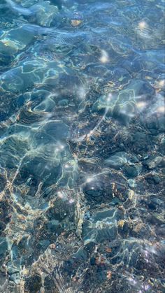 the water is crystal blue and clear with little ripples on it's surface