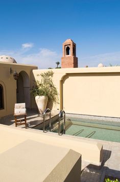 an outdoor hot tub on the roof of a house