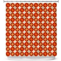 an orange and white shower curtain with geometric designs on it's sides, in the middle