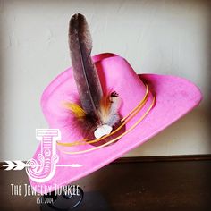 If you’re looking for the perfect accessory to complement your favorite boho style, look no further. The Boho-Style Western Felt Hat w/r Hat Band Accent by The Jewelry Junkie is absolutely everything that you need. Not only is it easy to incorporate into any and all outfits, but the genuine leather of the band immediately elevates whatever it is you’re wearing. The item that you receive in the mail will resemble the one in the picture but, because every piece by Jewelry Junkie is handmade, it wi Hat Bands, Large Feathers, Western Hat, Hat Fits, Leather Hat, Feather Hat, Ecommerce Website Design, Cowgirl Western, Blue Feather