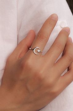 A beautiful crescent moon and star adjustable open band ring, made of solid 925 sterling silver, highly polished for a great shine. #silvermoonring #crecentmoonring #moonandstarring #sterlingsilverring #finejewelry #everydaystatementring Celestial Silver Midi Rings For Gift, Celestial Style Open Midi Rings As Gift, Dainty Silver Moon-shaped Ring, Silver Moon-shaped Midi Rings As Gift, Celestial Sterling Silver Midi Rings As Gift, Silver Crescent Dainty Rings, Celestial Sterling Silver Midi Rings For Gift, Celestial Style Sterling Silver Midi Rings For Gift, Silver Crescent-shaped Dainty Rings