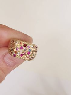 This is a 14 karat gold ring with multy colors saphires. A rectangular saphires pinky ring. Its a beautifull delicate ring that can be an anniversary gift, or a gift for yourself. The ring is a 14 karat gold and is set with round saphires. Please notice that each ring is handmade so each ring is a little different from the other. ITEM DETAILS Material: The ring is made of 14 karat gold. I can also make it in 18 karat gold by request. The saphires are multy colors and different sizes. Sizes: you Luxury Multicolor Ruby Ring, Multicolor Sapphire Ring With Diamond Prong Setting, Multicolor Sapphire Diamond Ring With Prong Setting, Multicolor Ruby Ring For Anniversary, Fine Jewelry, Multicolor Ruby Ring For Anniversary, Multicolor Ruby Ring In Fine Jewelry Style, Luxury Multicolor Rings With Prong Setting, Multicolor Ruby Ring Fine Jewelry, Yellow Gold Multi-stone Sapphire Ring With Cubic Zirconia