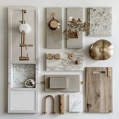 an assortment of bathroom accessories displayed on a wall with white and gold accents, including soap dispenser