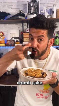 a man holding a plate with food in his hand and making a funny face at the camera