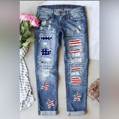 Patriotic Patch Sequin Star Distressed Denim Jeans Sequin Stars Of American Flag Pattern Together With Stars And Stripes Patches 75% Cotton 24% Polyester 1% Elastane Relaxed Style And Straight Leg Silhouette Can Be Worn Cuffed, Or Uncuffed There May Be Slight Differences On Details And Patterns As Each Pair Is Unique Pet Friendly Smoke-Free Home New Without Tags (Items Arrive Poly Bagged And Are Removed From The Bag For Photos). Casual Cotton Jeans With Star Print, Casual Blue Jeans With Star Print, Medium Wash Cotton Jeans With Star Print, Casual Jeans With Star Patch For Summer, Medium Wash Star Print Cotton Jeans, Casual Summer Jeans With Star Patch, Blue Jeans With Star Print For Summer, Trendy Medium Wash Jeans With Star Print, Blue Jeans With Star Print For Spring